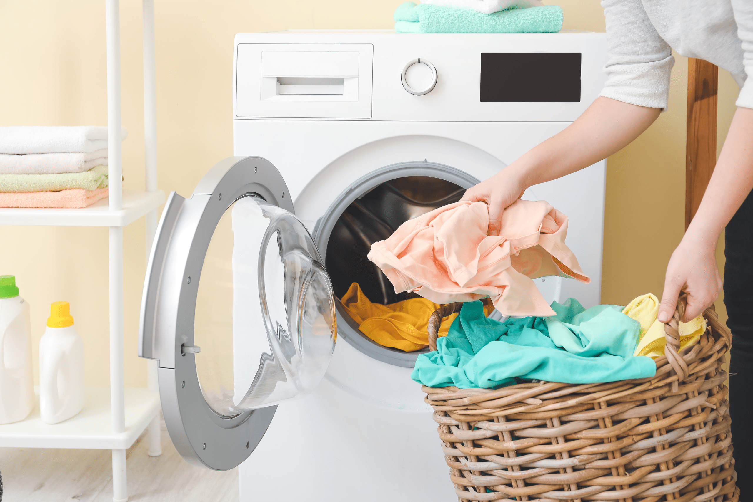 Person loading up the dryer.