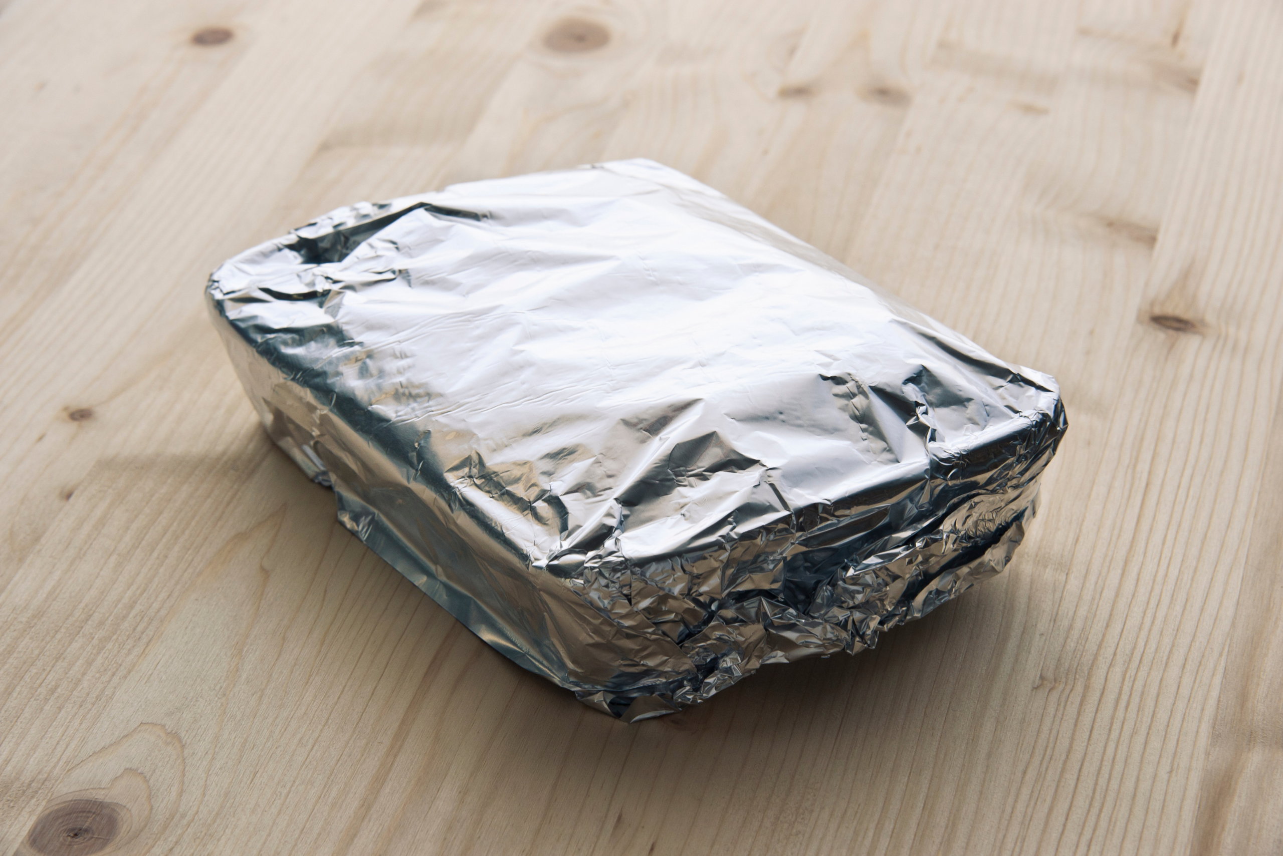 Food container covered in aluminum foil.