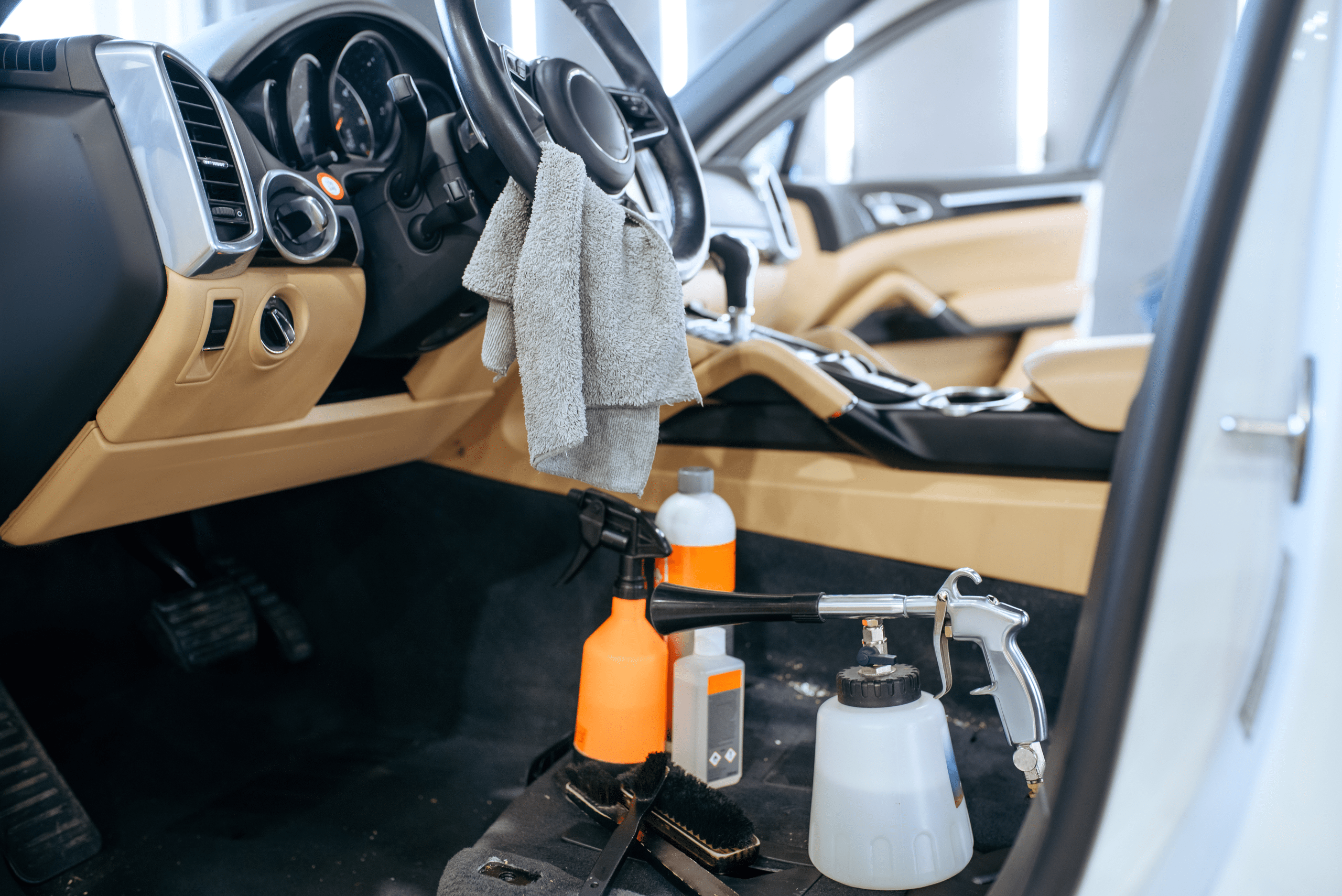 Cleaning supplies inside the interior of a vehicle.