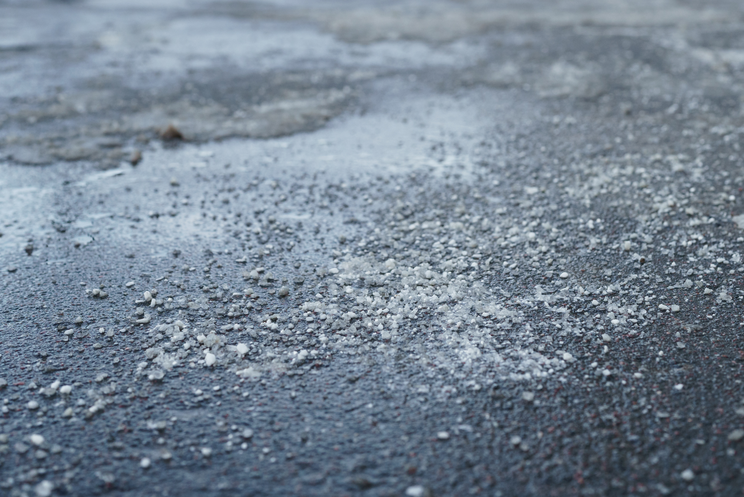 Rock salt on asphalt.