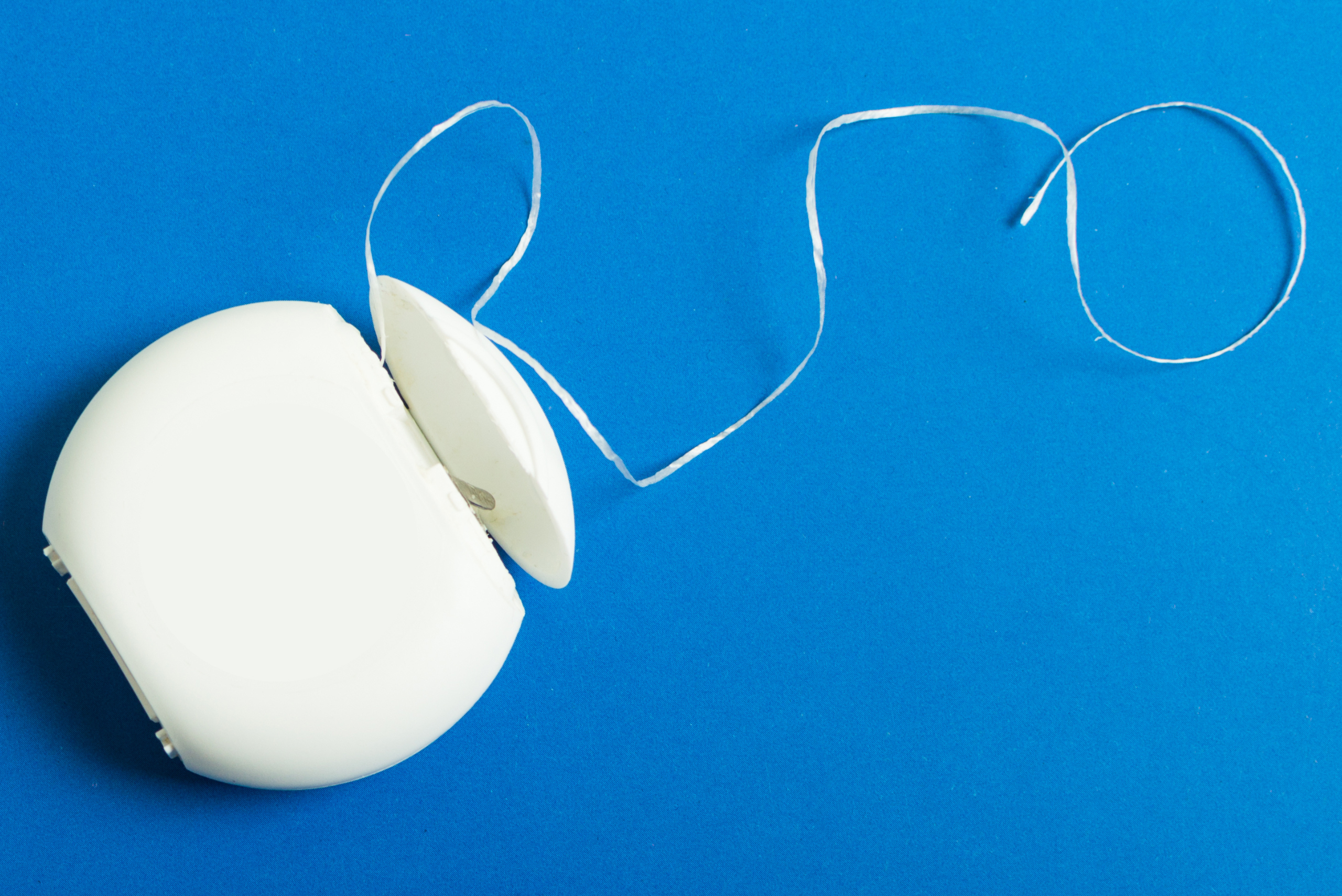 A container of floss string