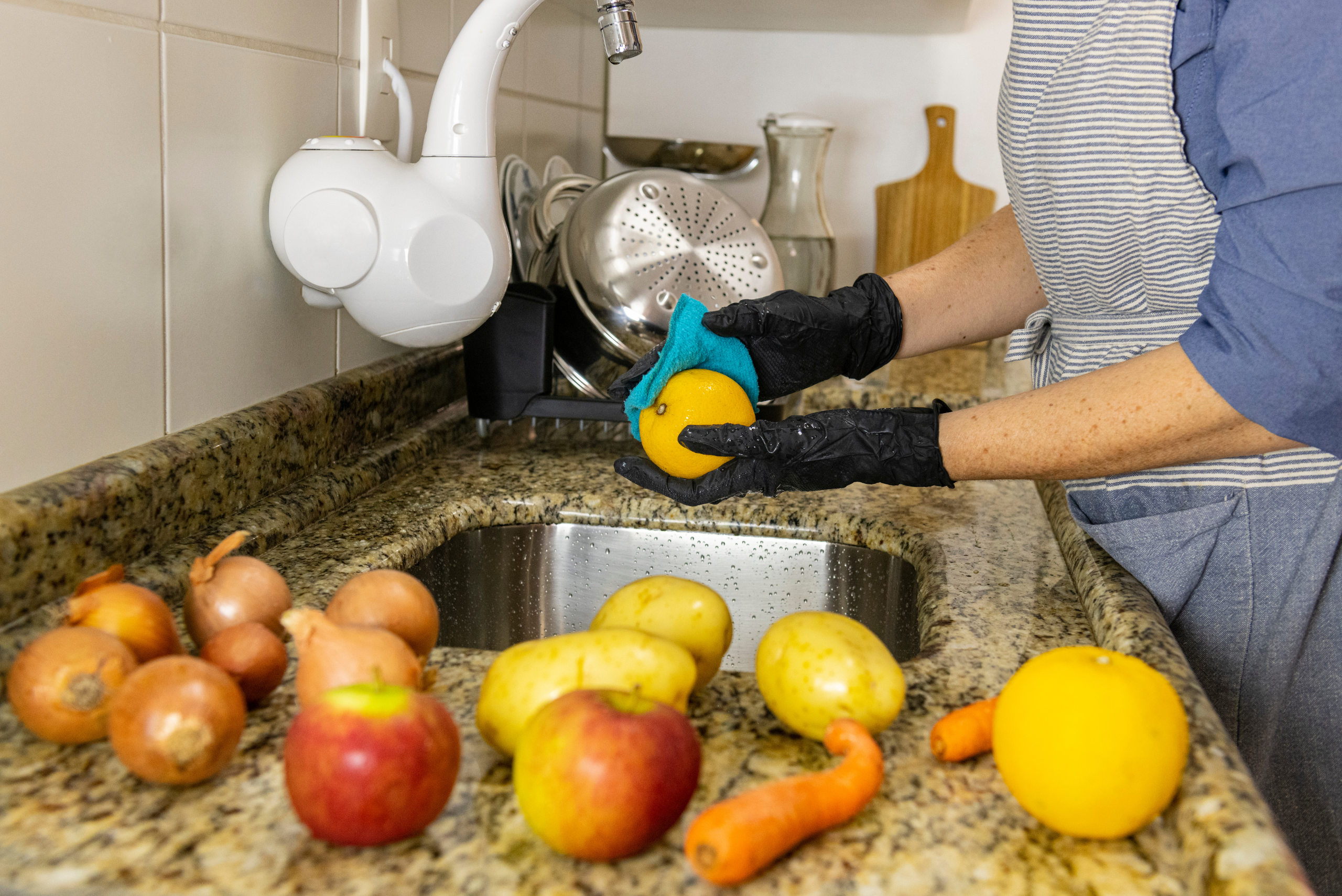 Wiping down fruit to dry it.