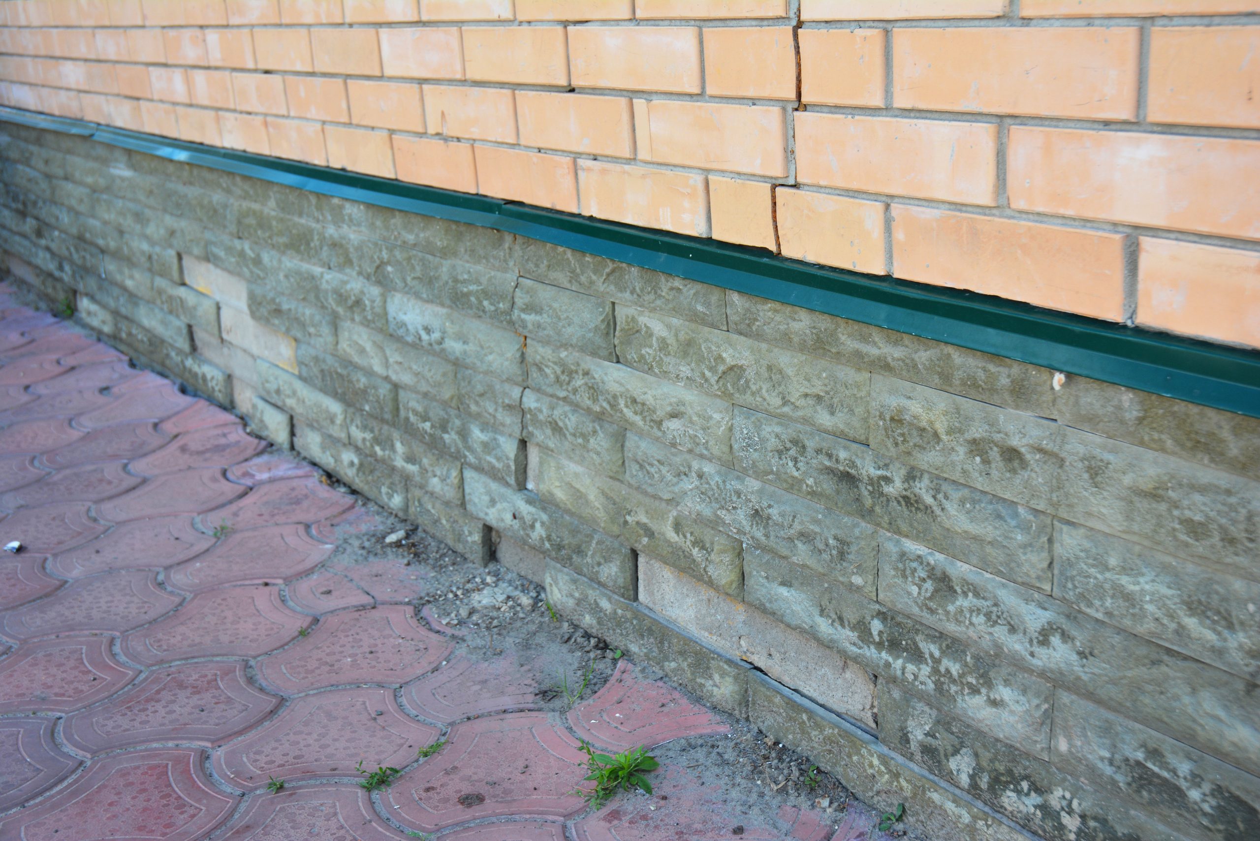 Closeup of a house's foundation.