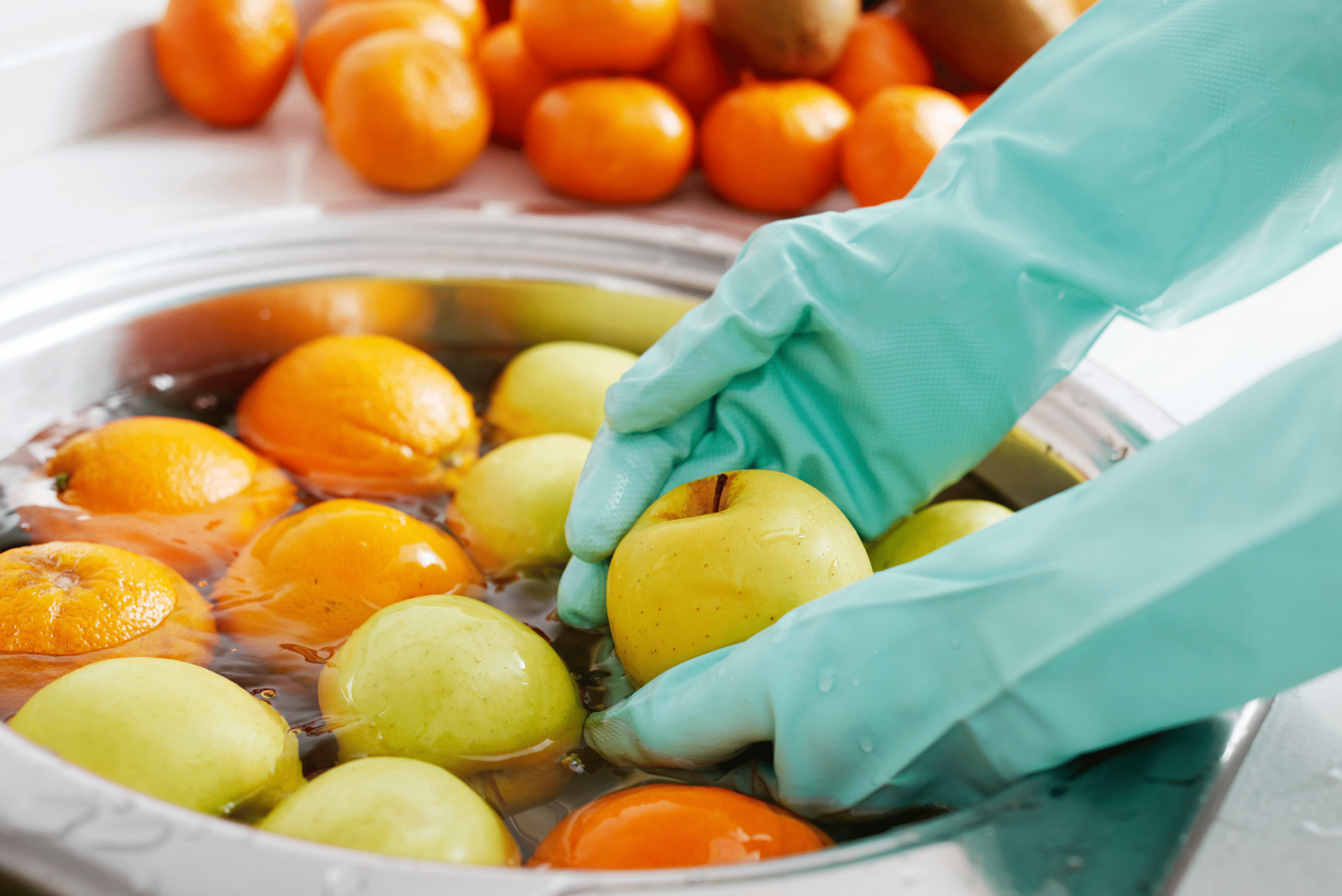 Washing fruit in a bowl.