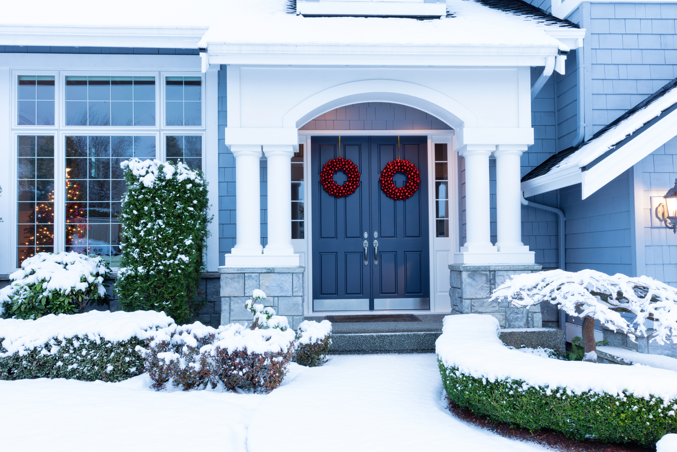 Snowy front of a house.