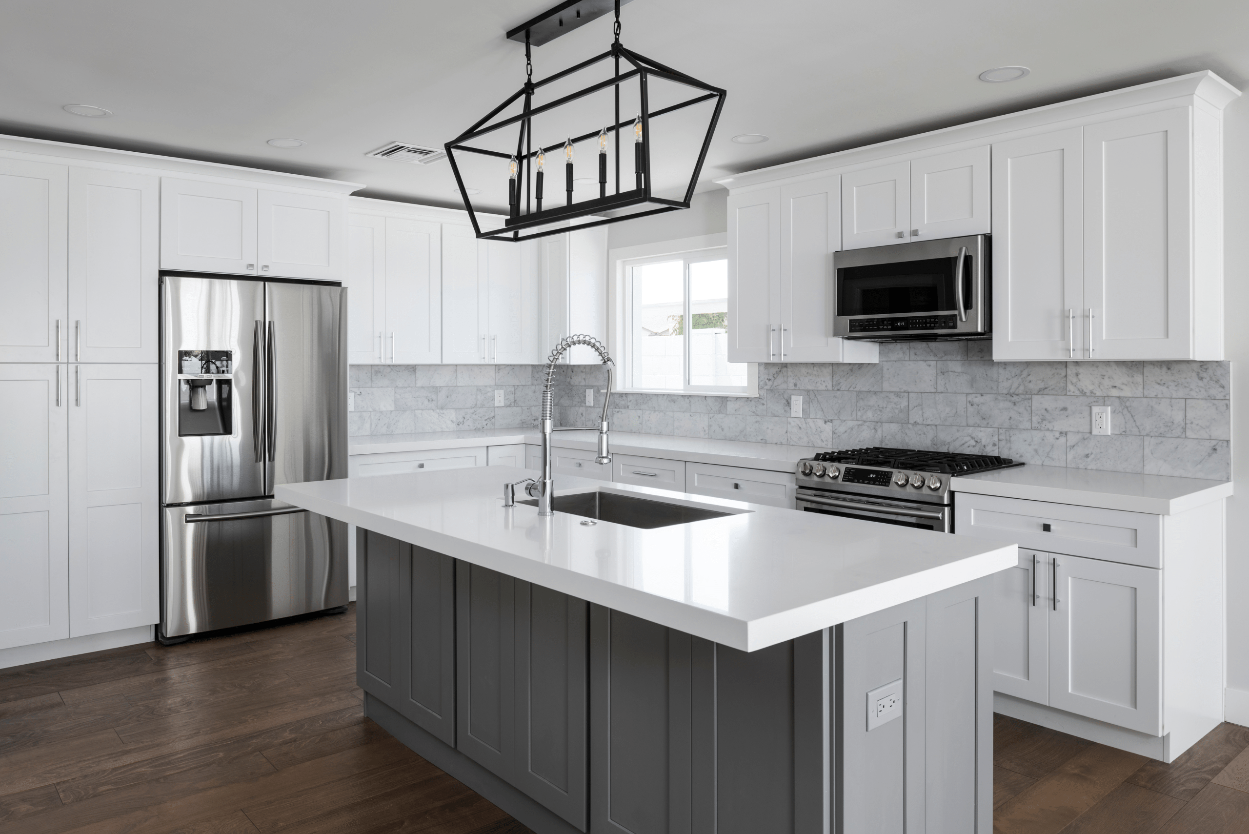 Large white and grey kitchen.