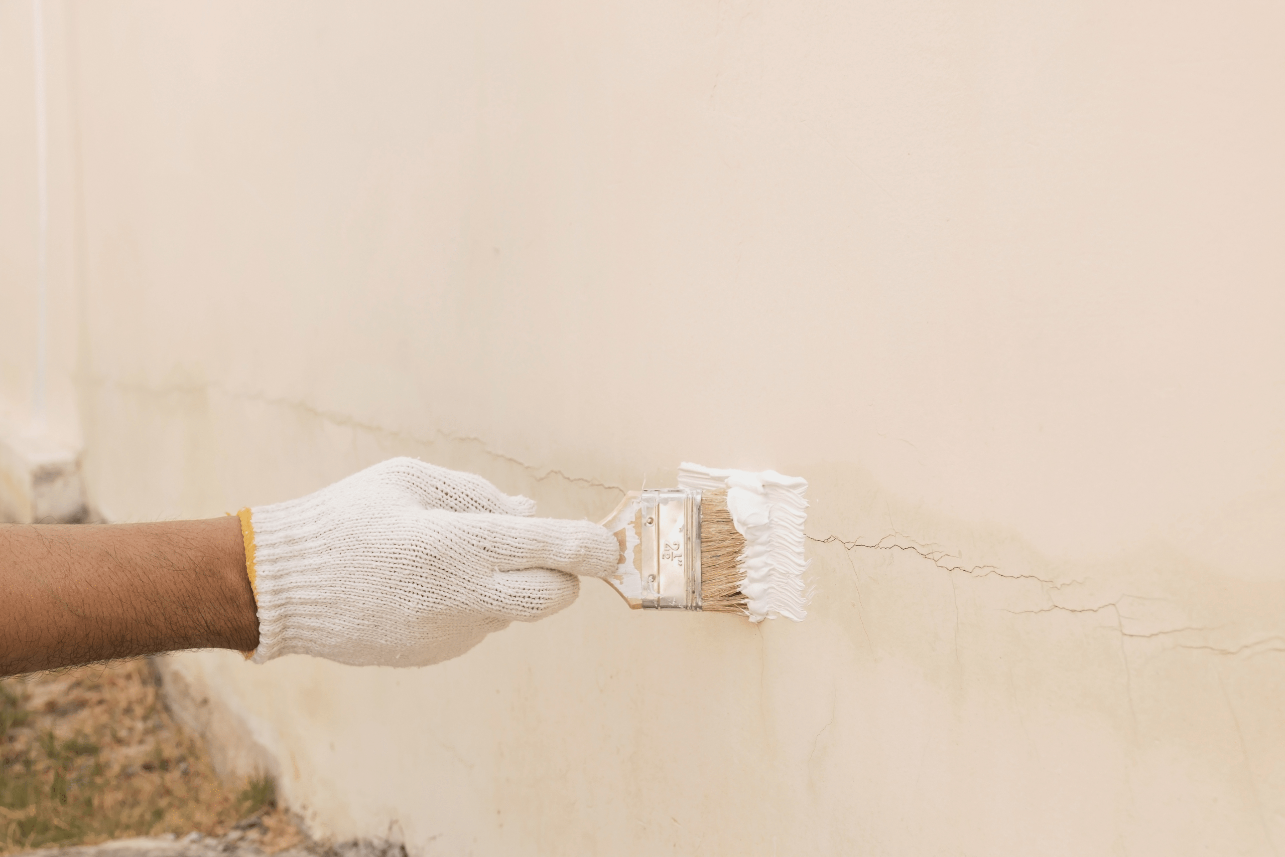 Sealing crack in a concrete wall.