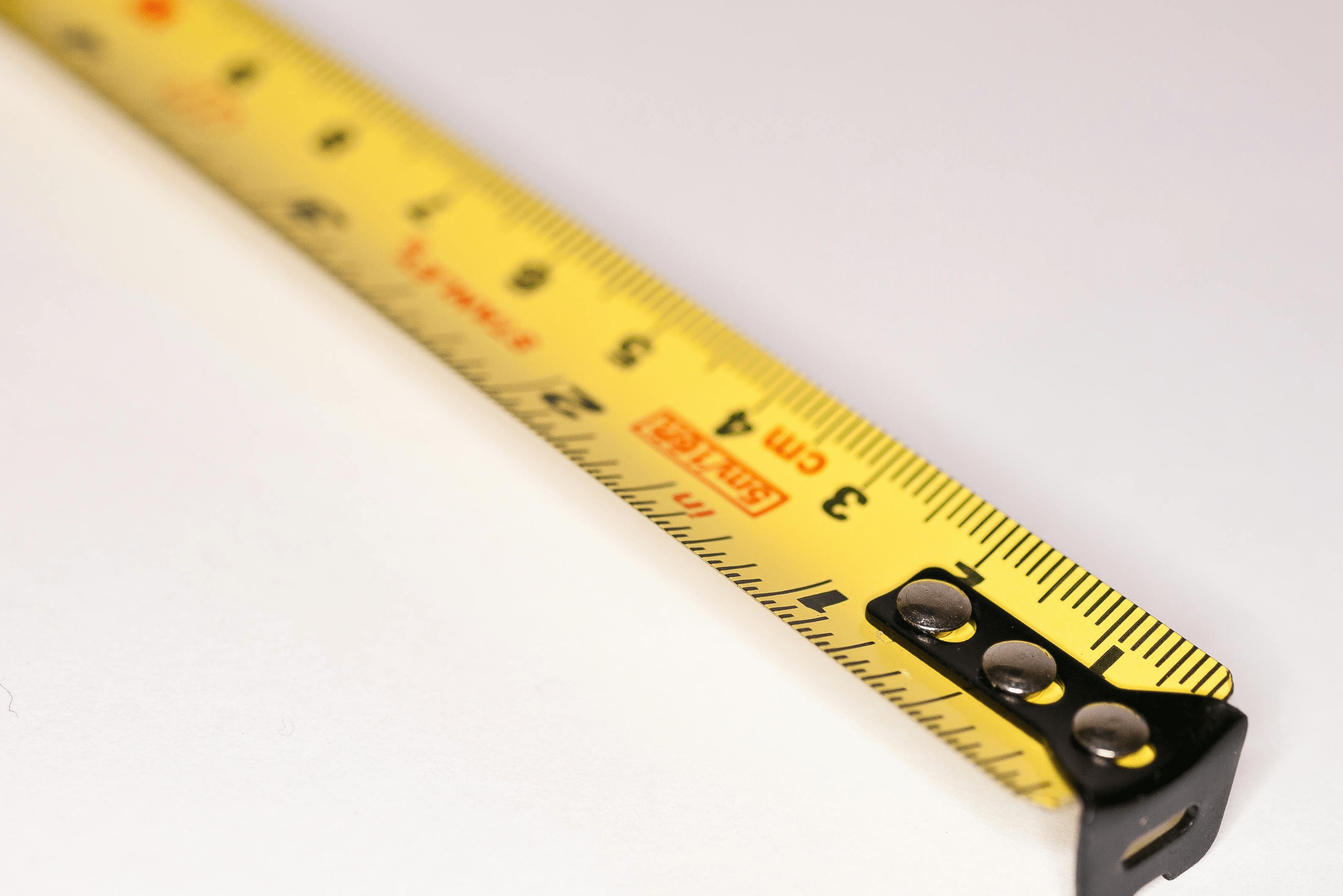 Measuring tape on a white background.