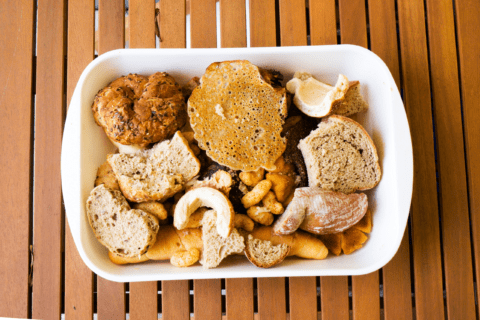 Stale bread in a white serving dish.