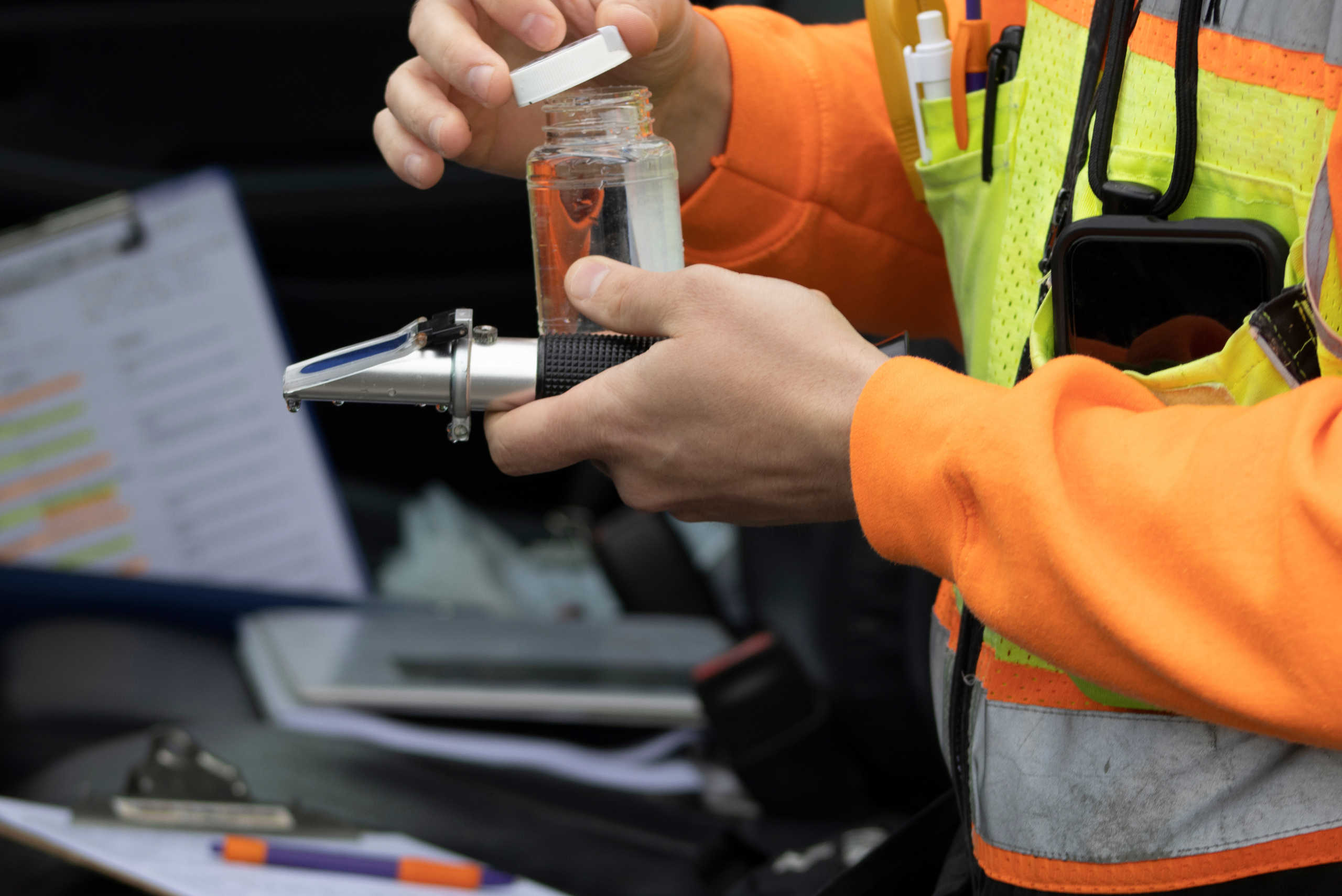 Worker testing water quality.