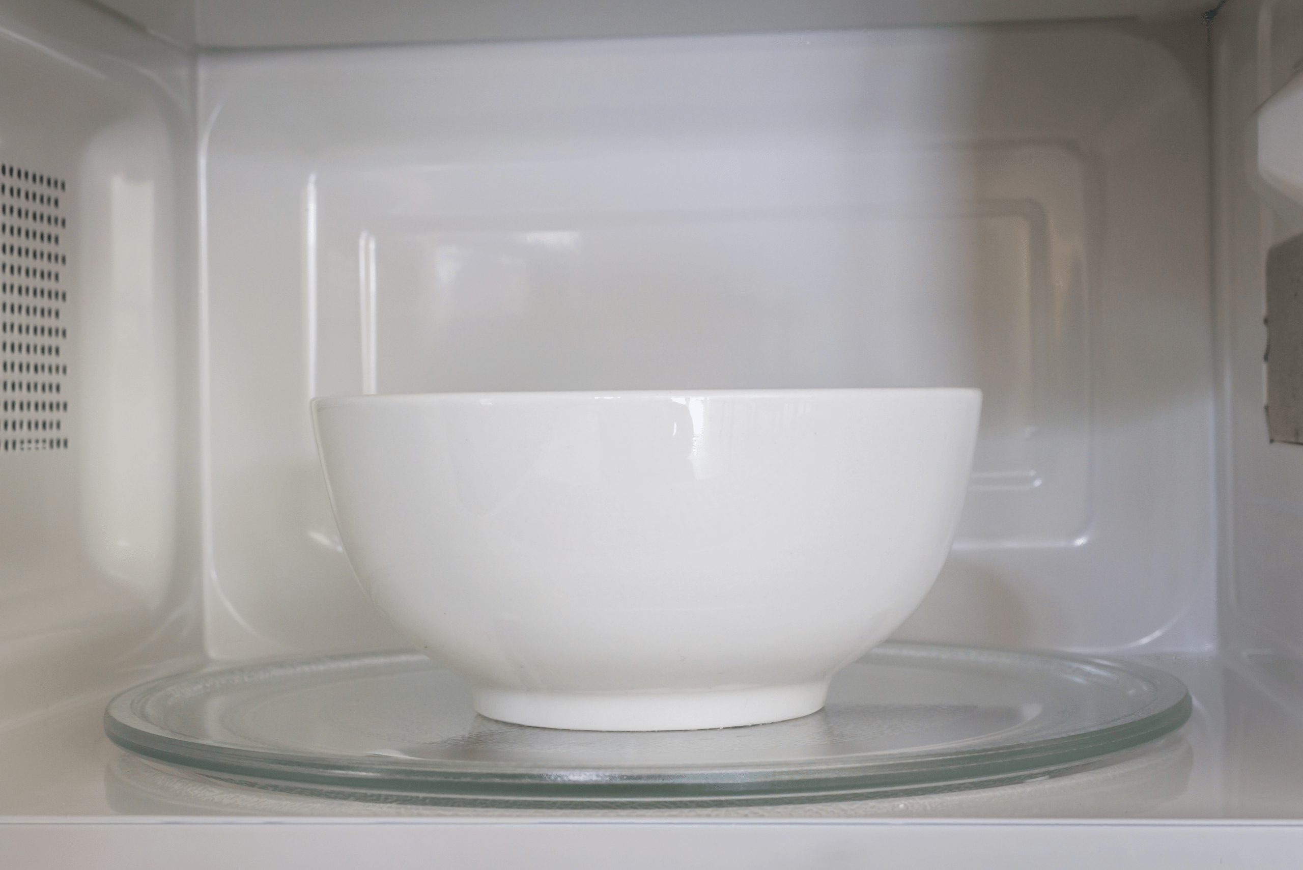 White bowl in a microwave.