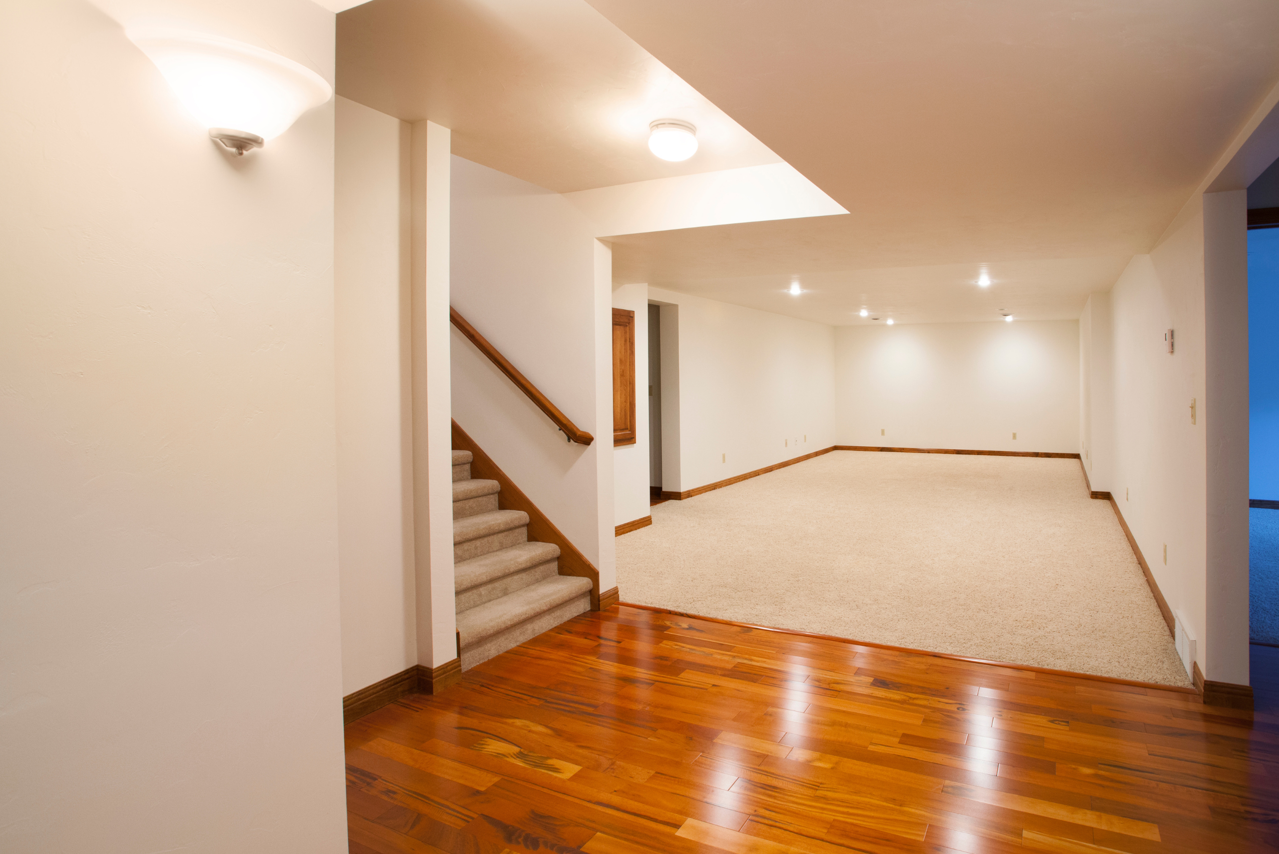 Shiny hardwood floor in basement.