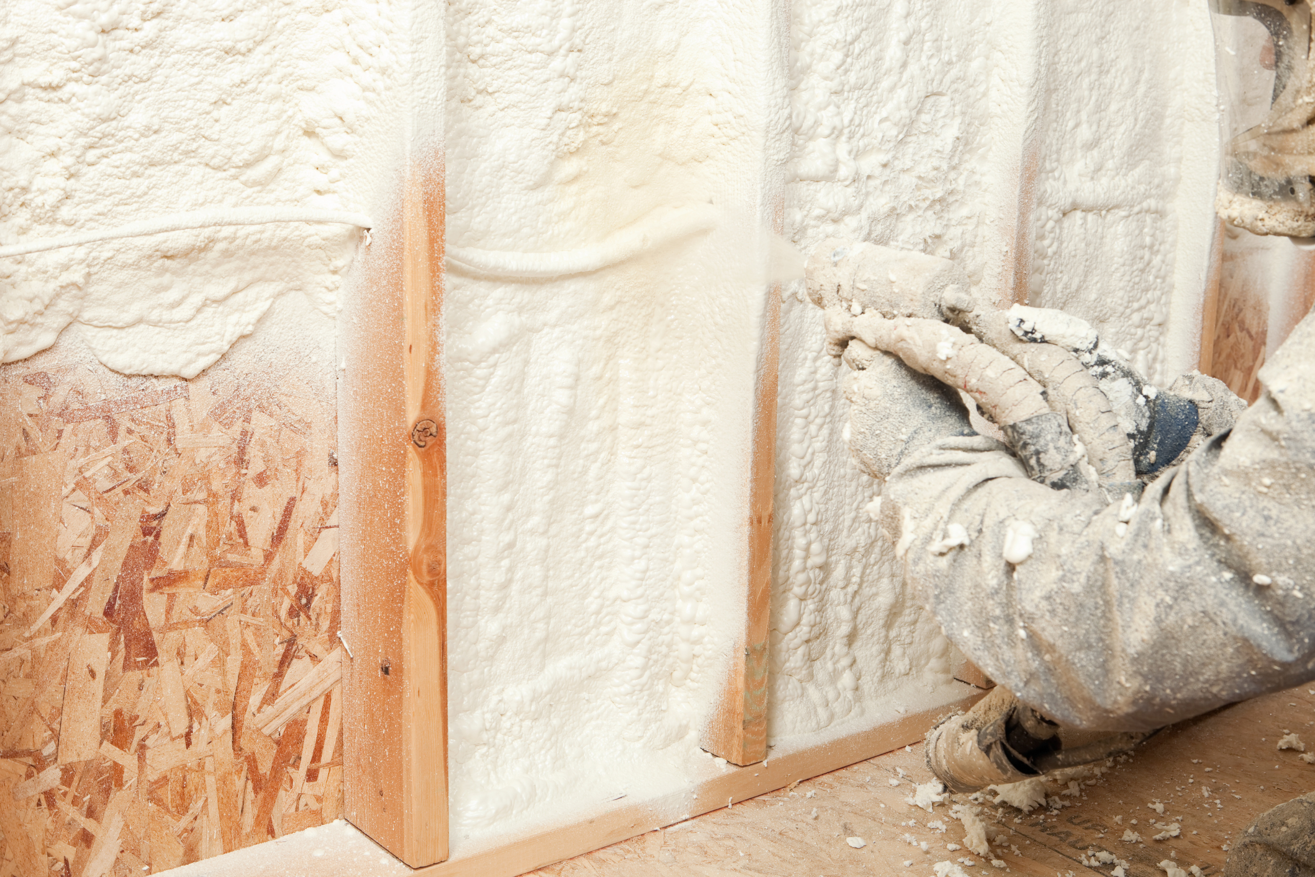 Installing insulation on exposed walls.