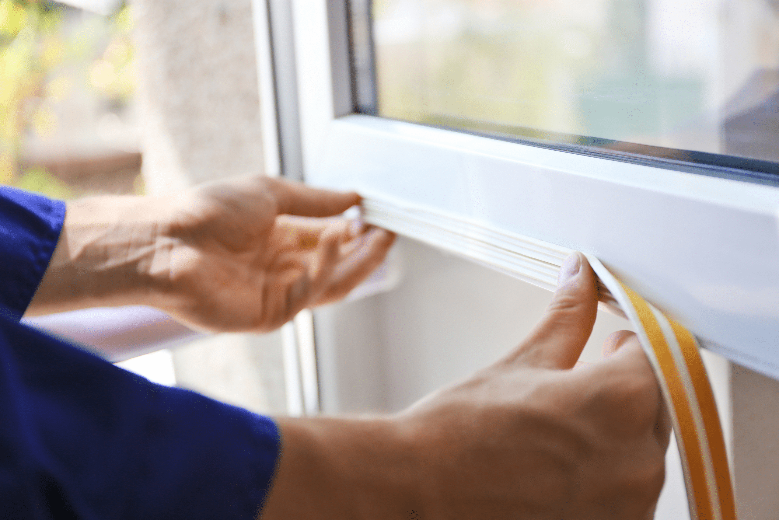 Adding weatherstripping to door.