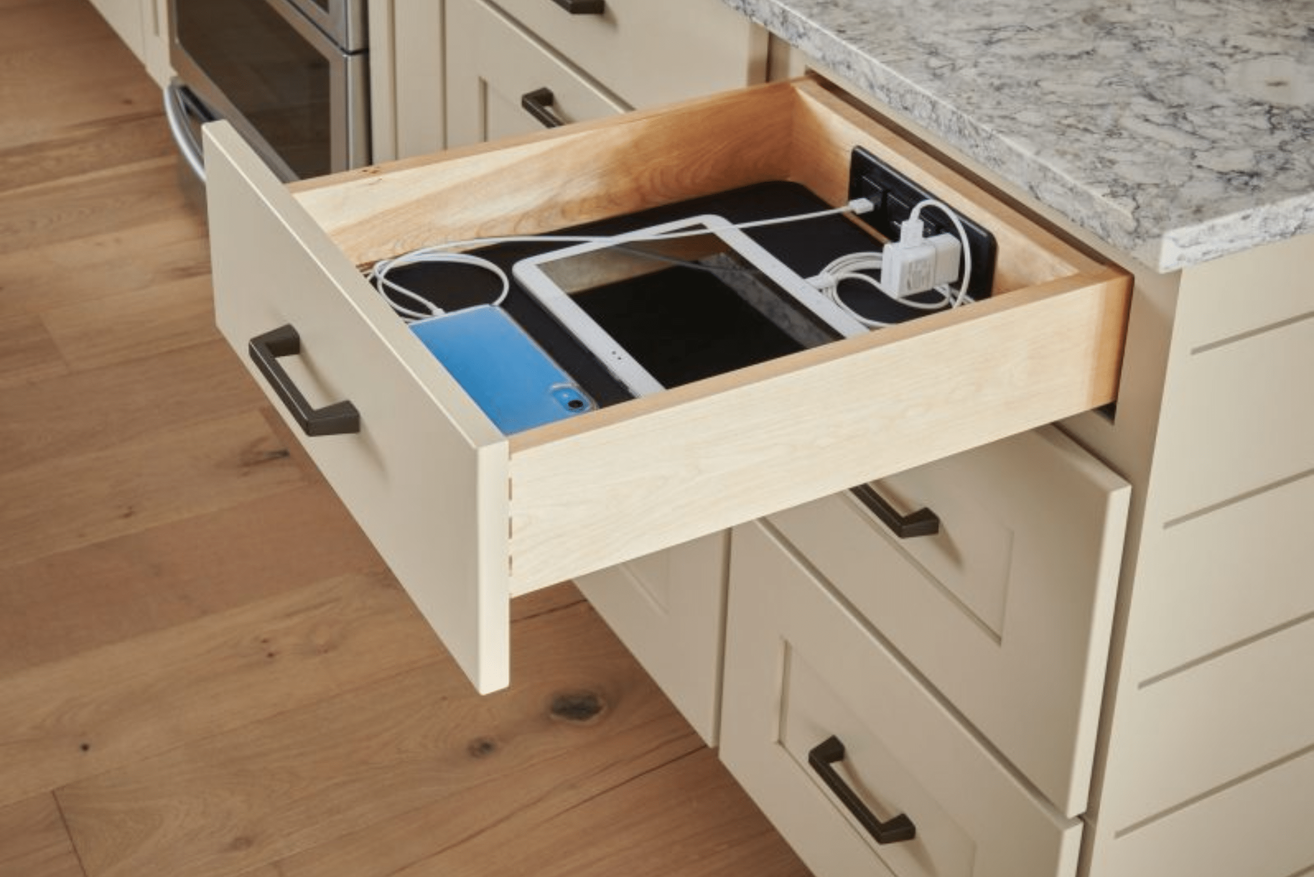 Cords organized inside a drawer.